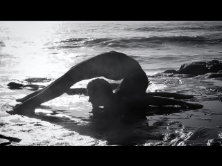 bending on the beach